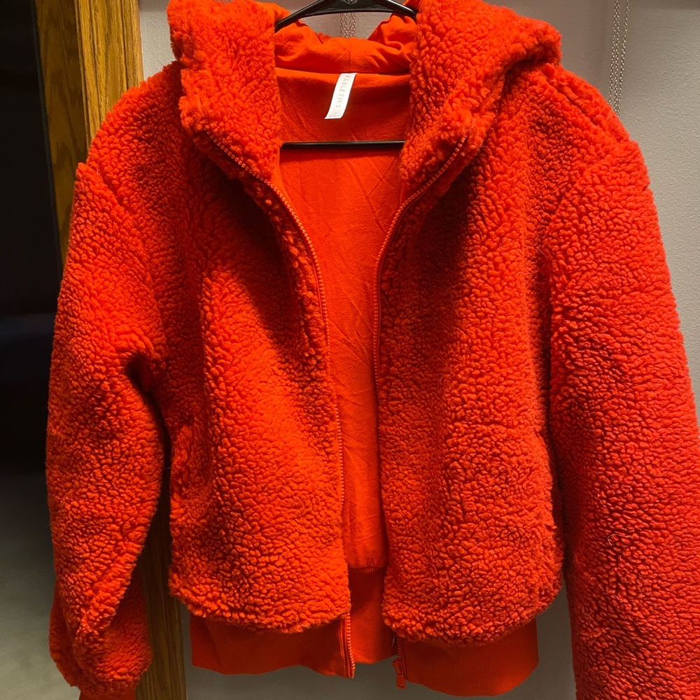 Fabletics fuzzy cropped hooded zip up in Red